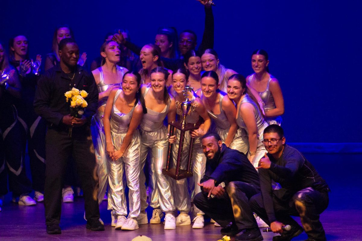 Gamma Phi Beta, the winners of Stroll XI pose with trophy and members of Alpha Phi Alpha, photo by Amanda Eacho
