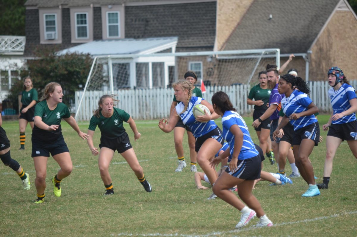 Robin Robinson running with the ball and avoiding tackles