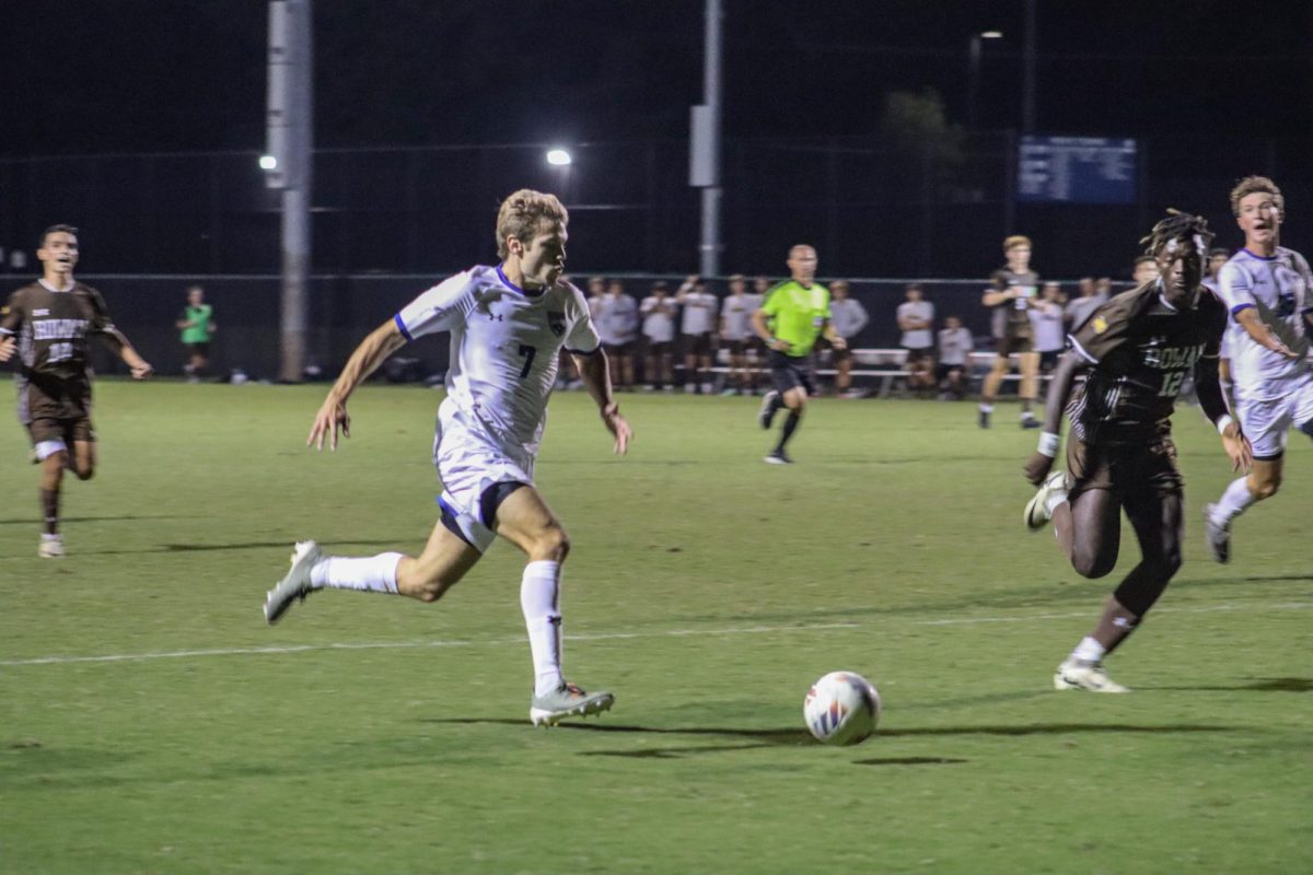 Midfielder Matt Liss taking the ball down the field