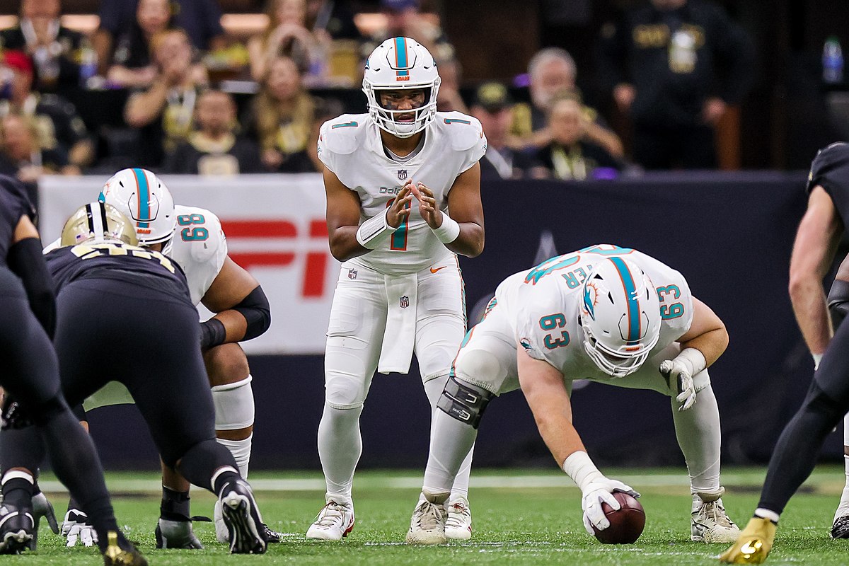 Miami Dolphins quaterback Tua Tagovialoa
(1) calls for the ball from center Michael
Deiter (63) against the New Orleans Saints
during the first half of a 2021 regular season
game at Caesars Superdome. Miami Dolphins
at New Orleans Saints 2021 by Stephen Lew-USA TODAY Sports is licensed under the
CC BY-SA 2.0 Deed