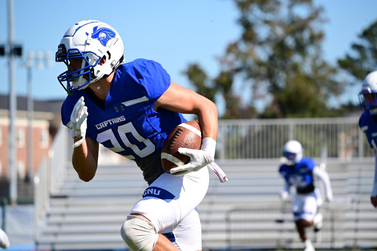 Defensive Back Jackson Schnetzler intercepts a ball during warm-ups
before the game, taken by Wyatt Miles