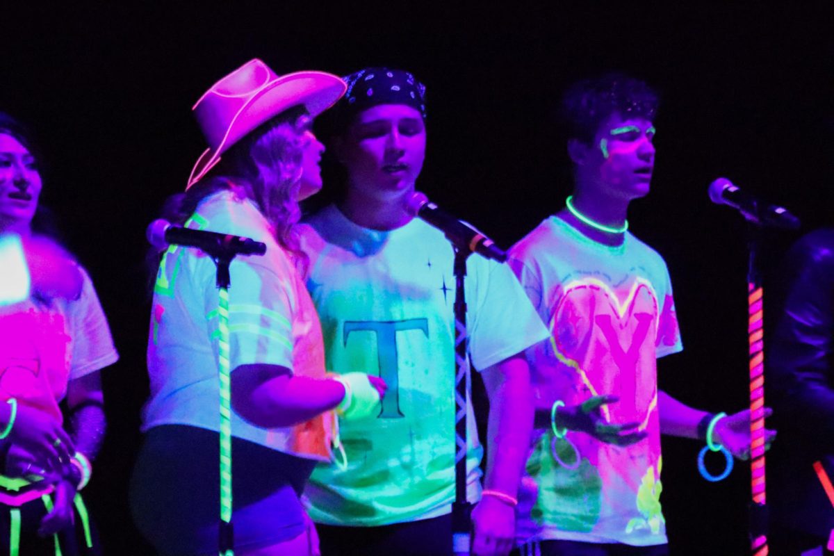 Two University Sounds Members performing during GLOW