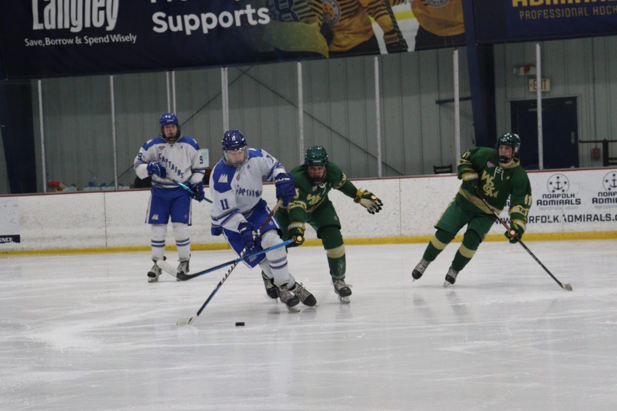 Defensemen Kevin Donnelly defends puck from opposing W&M
player