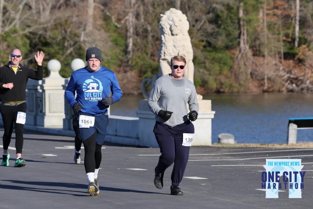 Seniors Anthony Berry (left) and Dylan Frederick (right) cross the Lions Bridge running in the One City Marathon together on
March 2, photo courtesy of Anthony Berry.