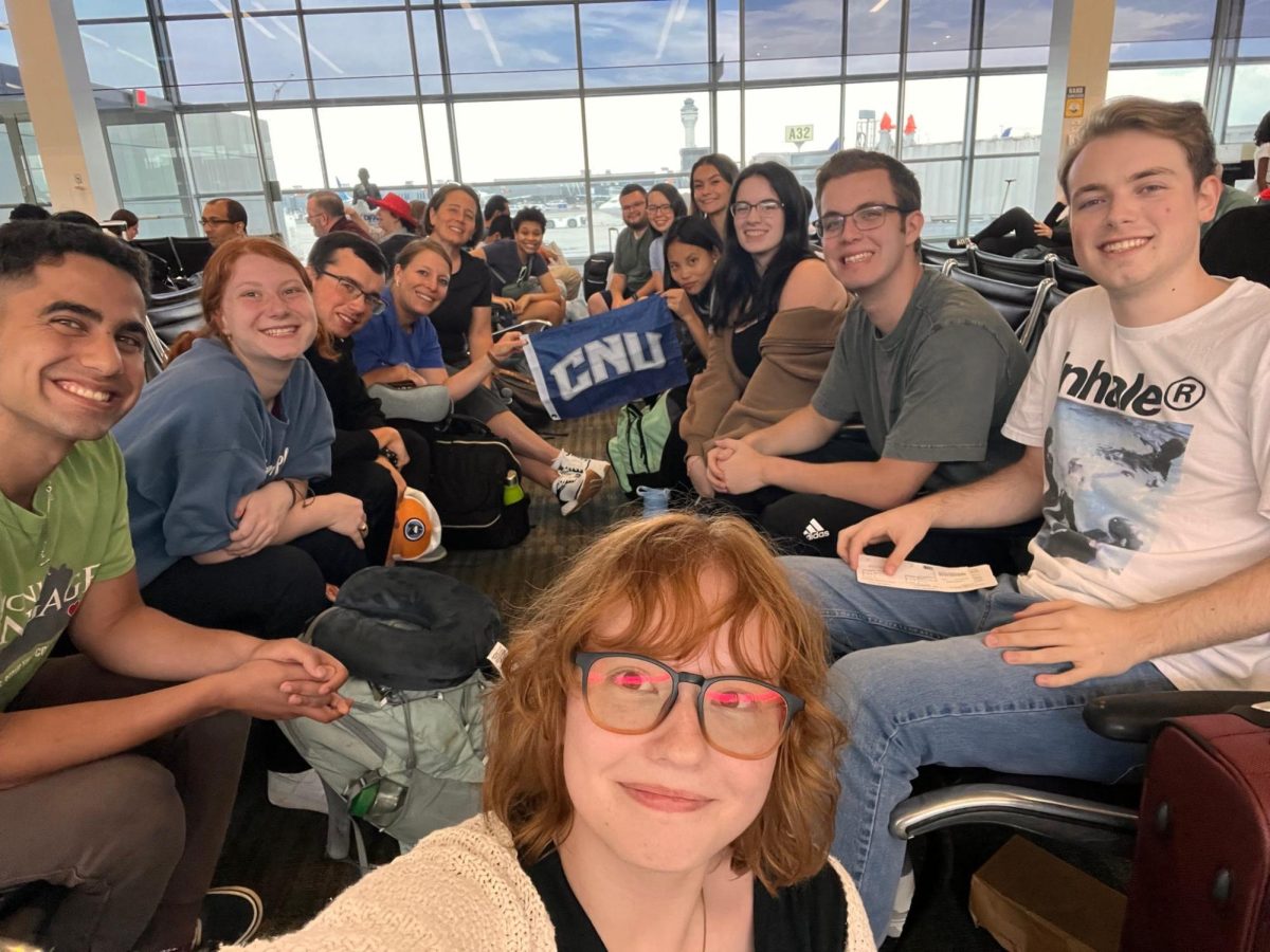 Students posing for a picture at the Dulles International Airport taken by Emma Recupero