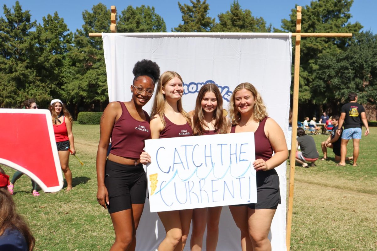 Members of CHAARG posing with their sign during the event, taken by Lindsay
Deyton