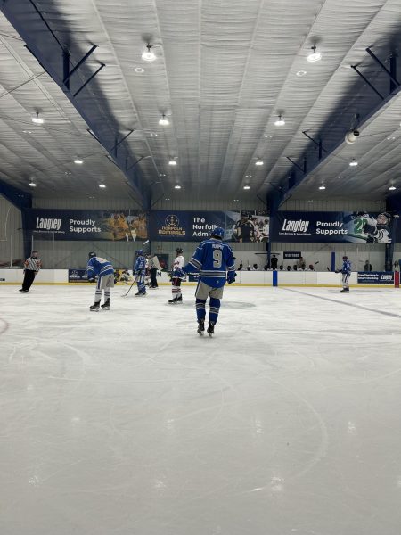 CNU Ice Hockey defensemen Cian Murphy
and others setting up for a face off, photo
taken by Bre Dorrian