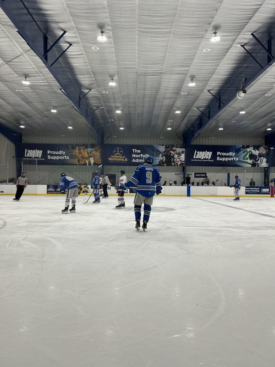CNU Ice Hockey defensemen Cian Murphy
and others setting up for a face off, photo
taken by Bre Dorrian