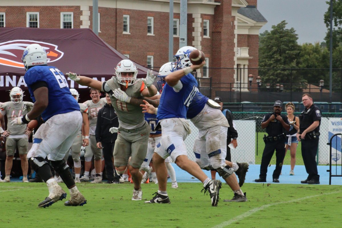CNU football player throwing ball during
Family Weekend home game, photo taken by Lindsay Deyton
