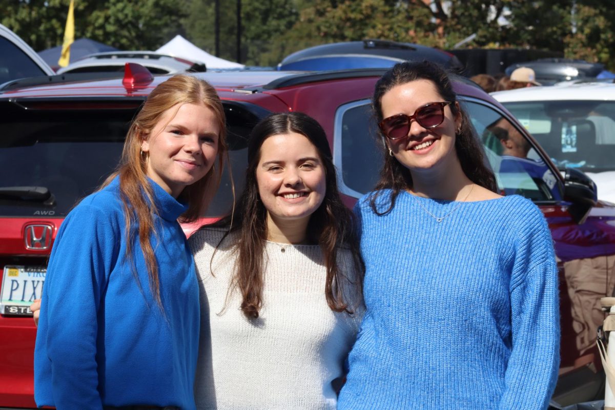 Tailgaters pose for a picture before the football game Saturday night