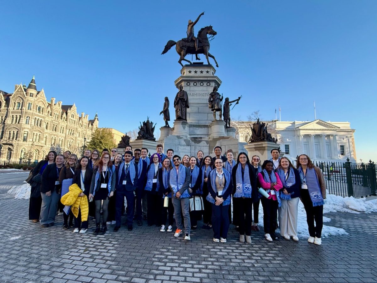 CNU Students and members of the Wason Center pose for a group photo in front of the George Washington Equestrian monument in the capitol