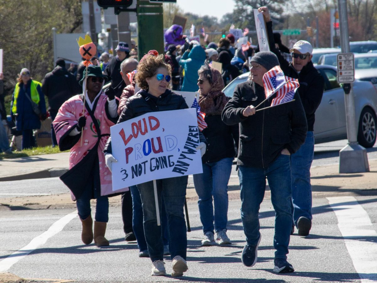 Protestors walking down Jefferson Avenue with signs